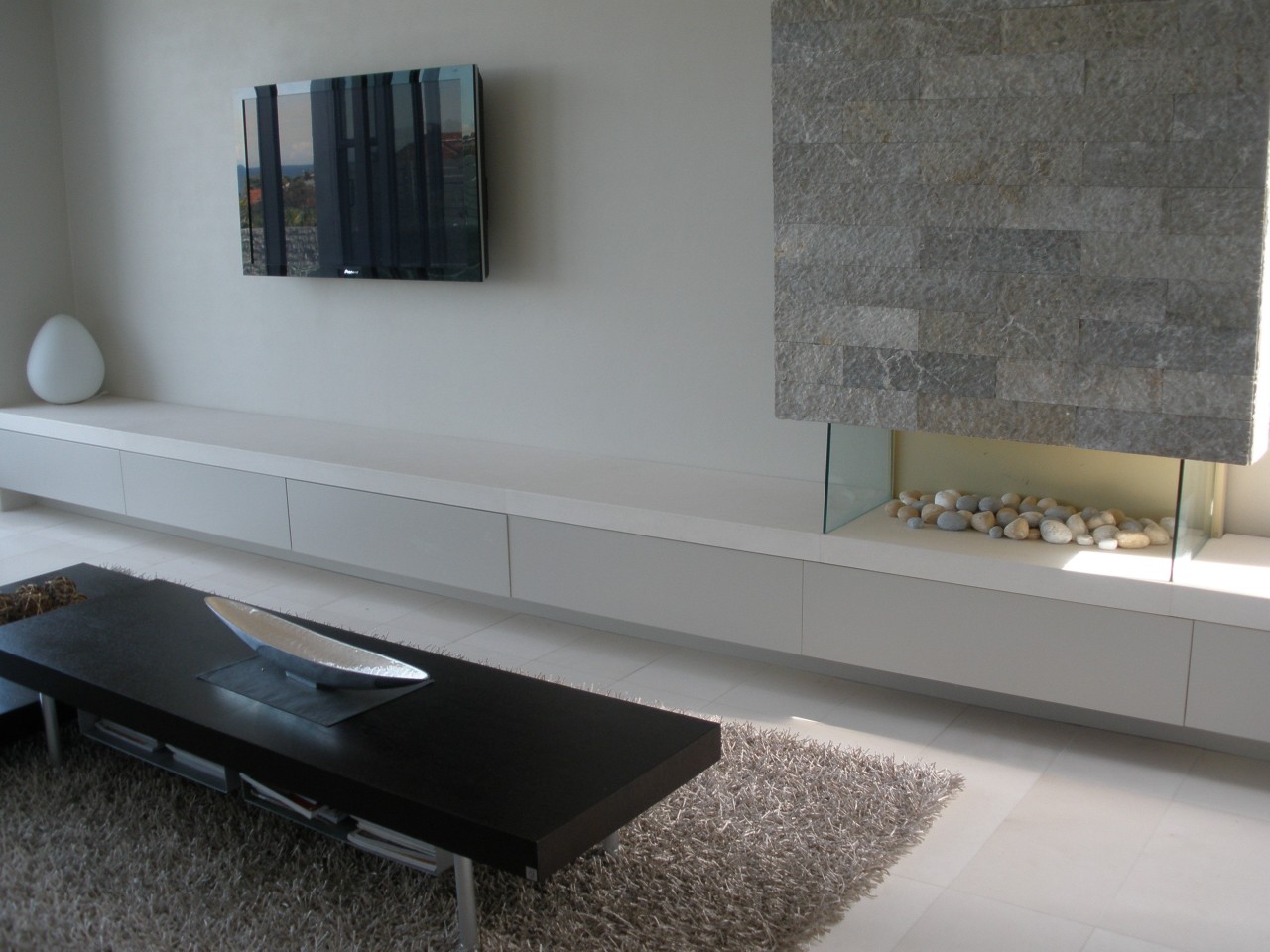 View of gray block wall cladding from Sareen coffee table, floor, flooring, furniture, interior design, living room, product design, shelf, sideboard, table, wall, gray