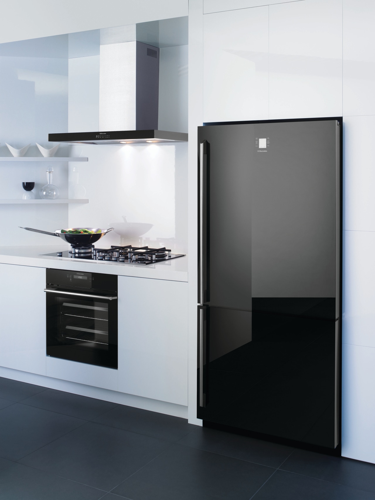 View of a kitchen which features a refrigerator, home appliance, interior design, kitchen, kitchen appliance, kitchen stove, major appliance, product, product design, refrigerator, white, black