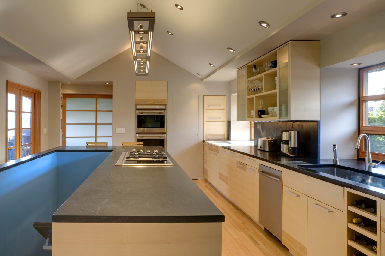 View of a kitchen which features a kitchen cabinetry, ceiling, countertop, cuisine classique, hardwood, interior design, kitchen, real estate, room, brown, orange