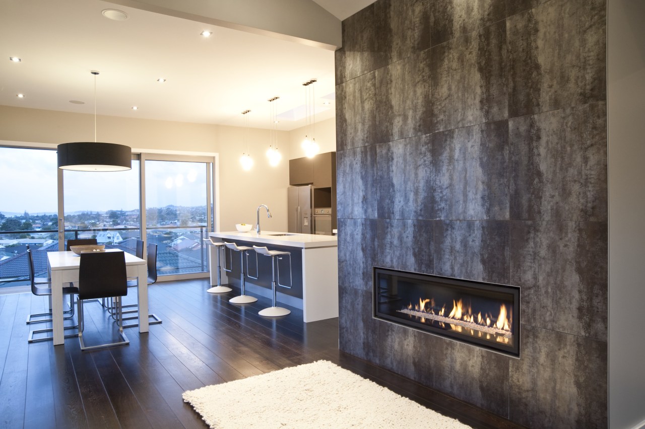 interior view of the New David Reid show ceiling, fireplace, floor, flooring, interior design, interior designer, living room, wall, orange