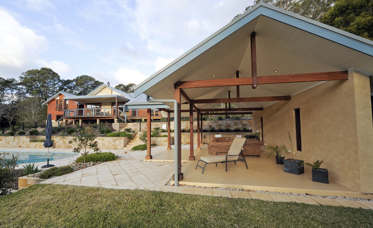 Exterior view of a remodelled house. Designed and estate, home, house, outdoor structure, property, real estate, roof, brown, white