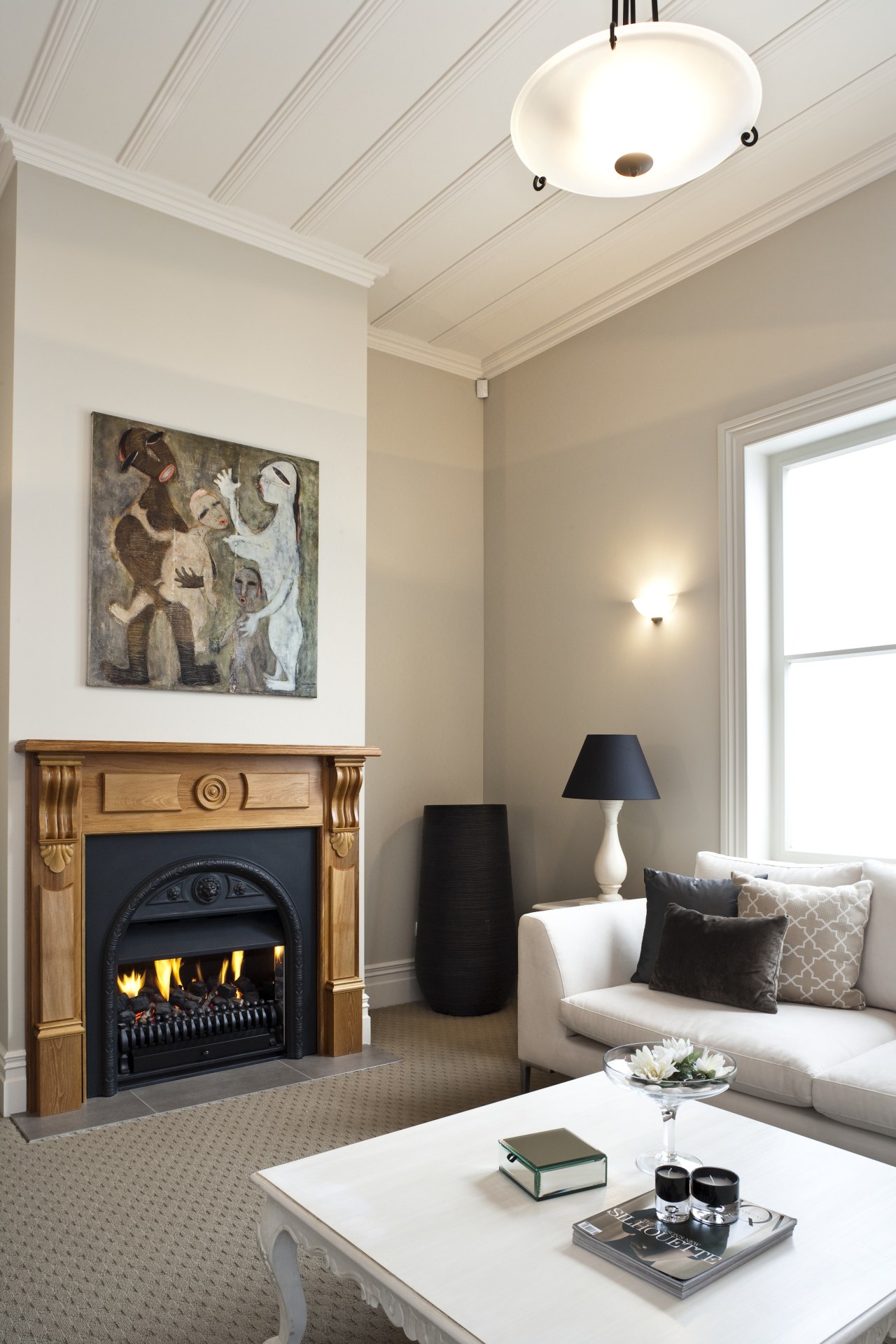 View of a living area which features a ceiling, fireplace, hearth, home, interior design, living room, room, wall, gray