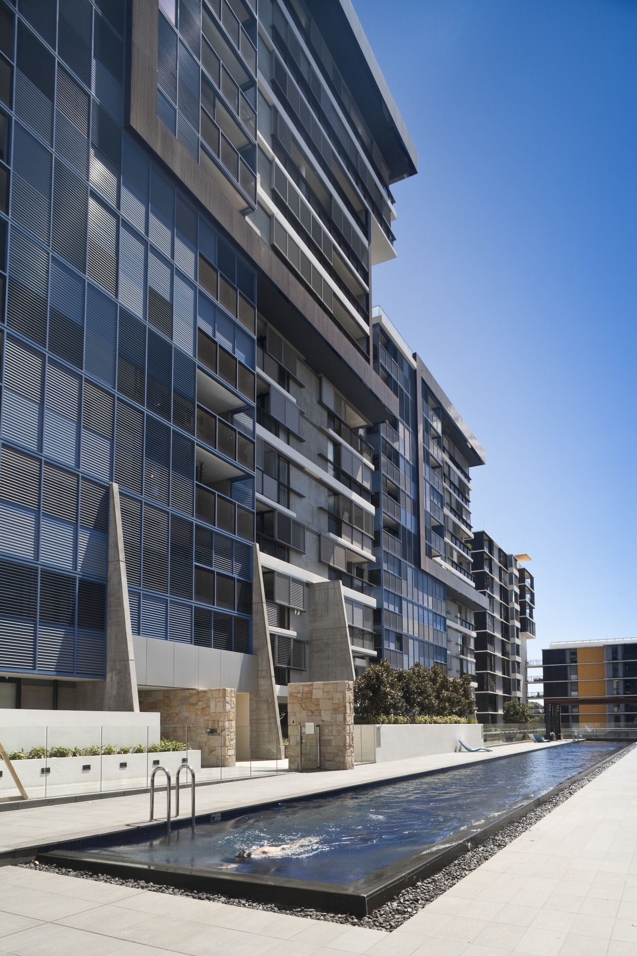 Good things come in threes. The new Trio apartment, architecture, building, commercial building, condominium, corporate headquarters, daytime, facade, headquarters, mixed use, real estate, reflection, residential area, sky, window