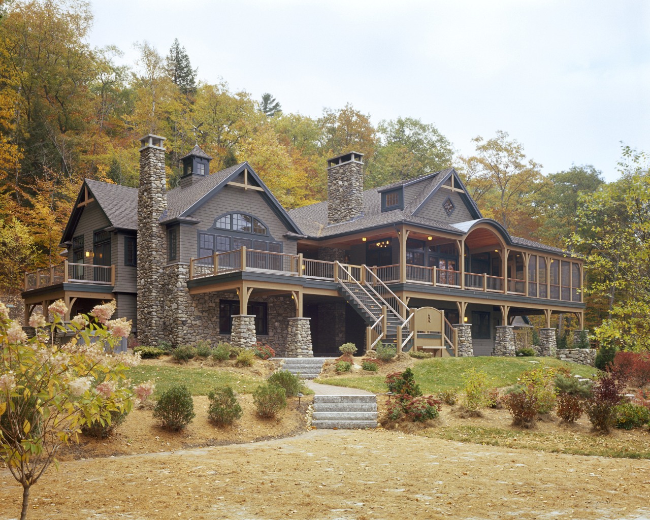 View of the holiday homes exterior featuring white cottage, estate, farmhouse, historic house, home, house, landscape, property, real estate, residential area, roof, siding, tree, brown