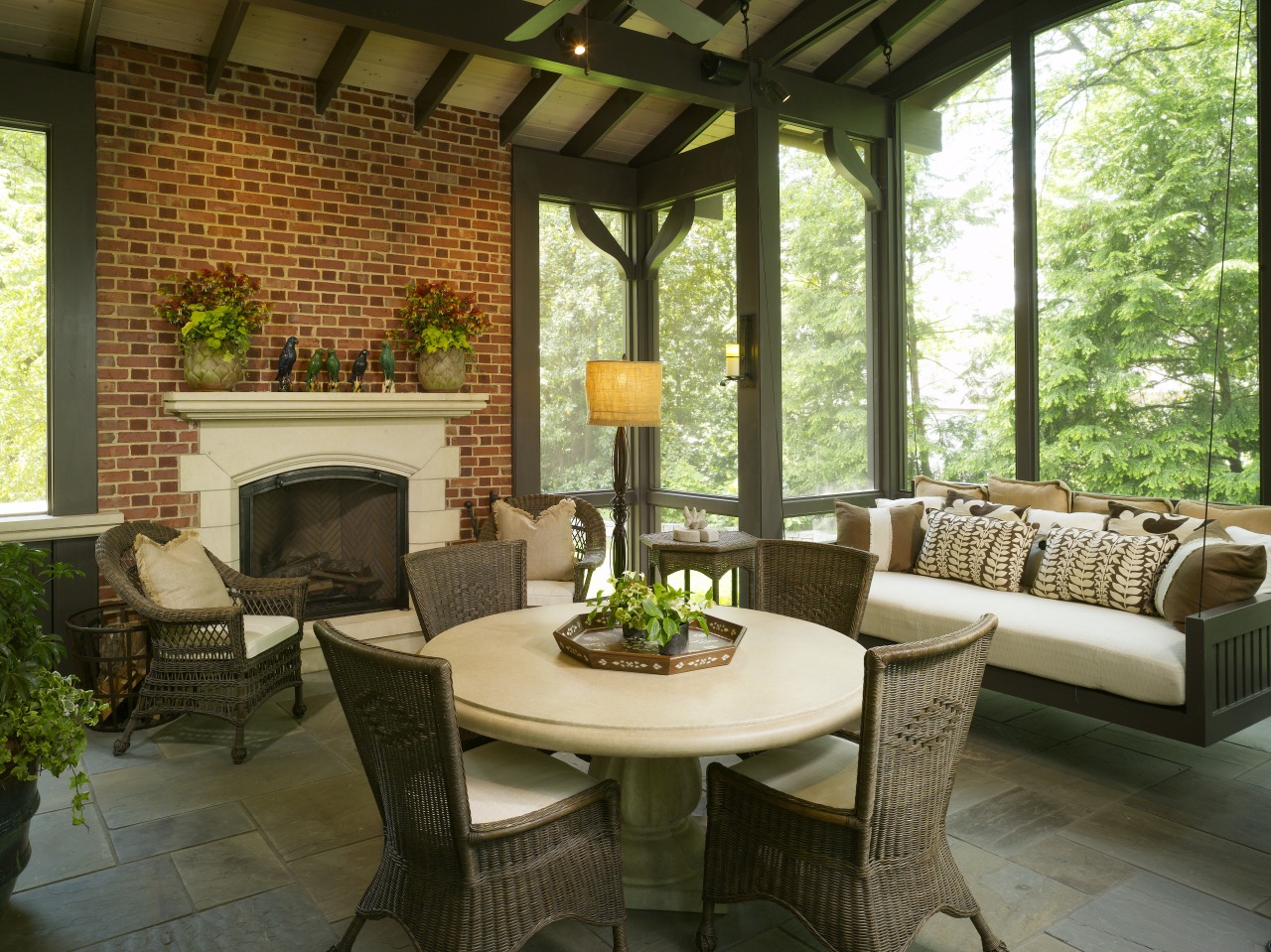 Traditional style living area featuring fireplace &amp; furniture backyard, home, interior design, living room, outdoor structure, patio, porch, real estate, table, window, brown