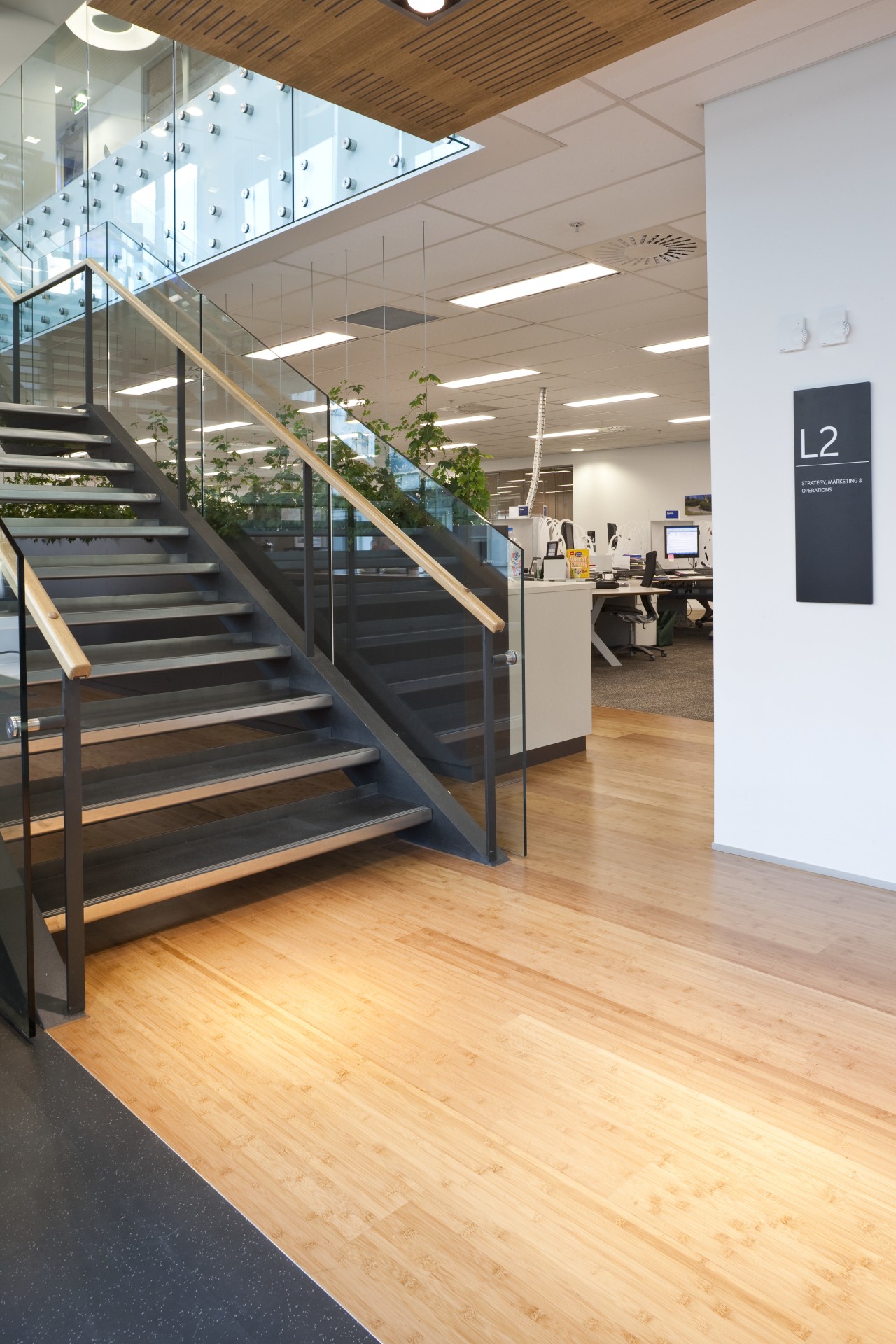 View of the staff room of the BNZ floor, flooring, handrail, hardwood, interior design, laminate flooring, stairs, wood, wood flooring, orange