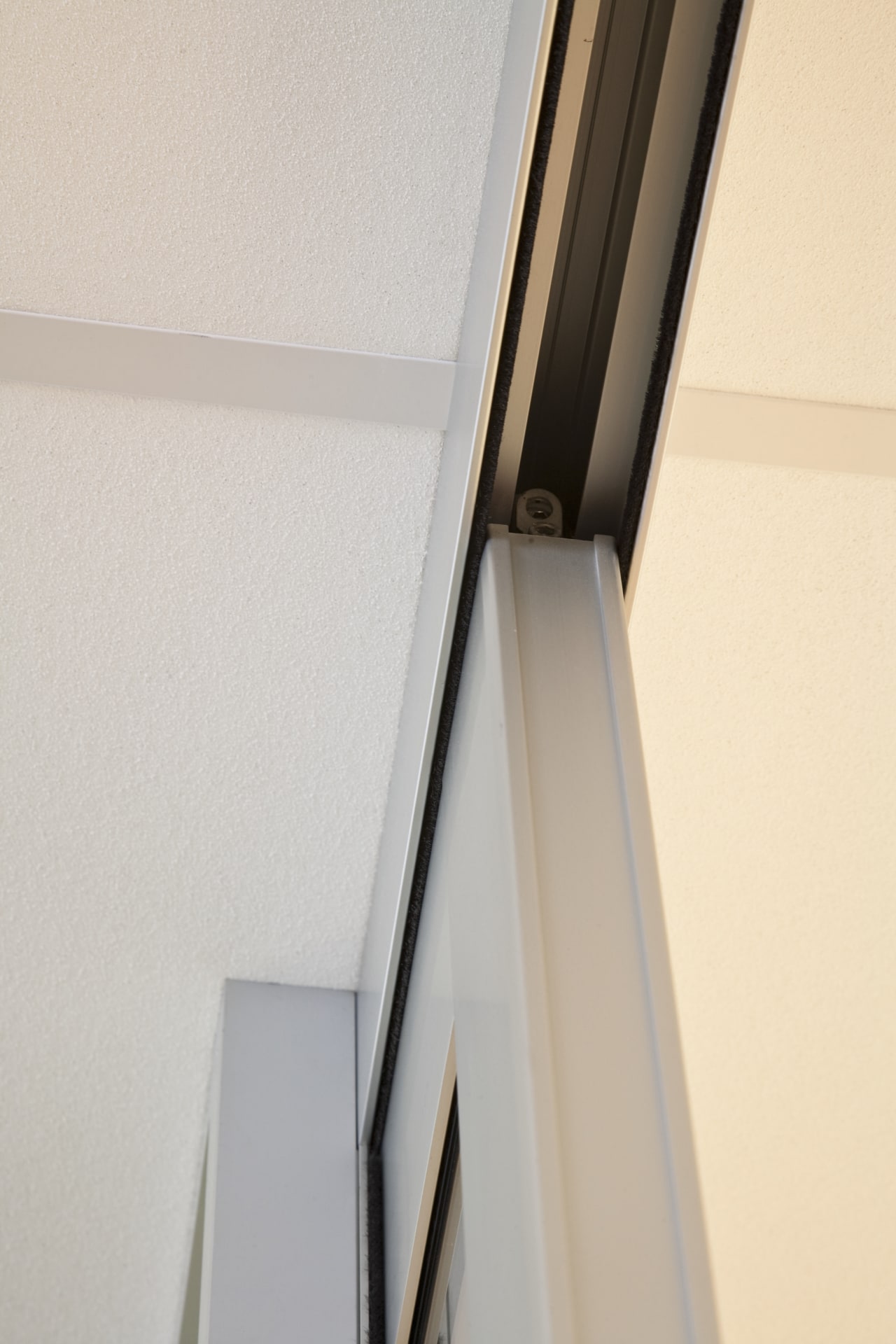 View of glass aluminium sliding doors inside the angle, product design, white