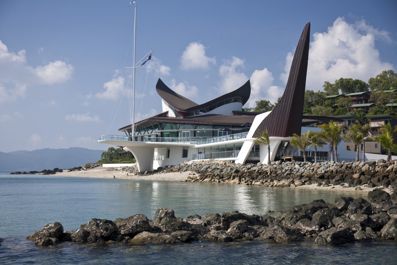 With its distinctive sail and keel forms, the coast, coastal and oceanic landforms, sea, sky, tourism, water, teal, gray