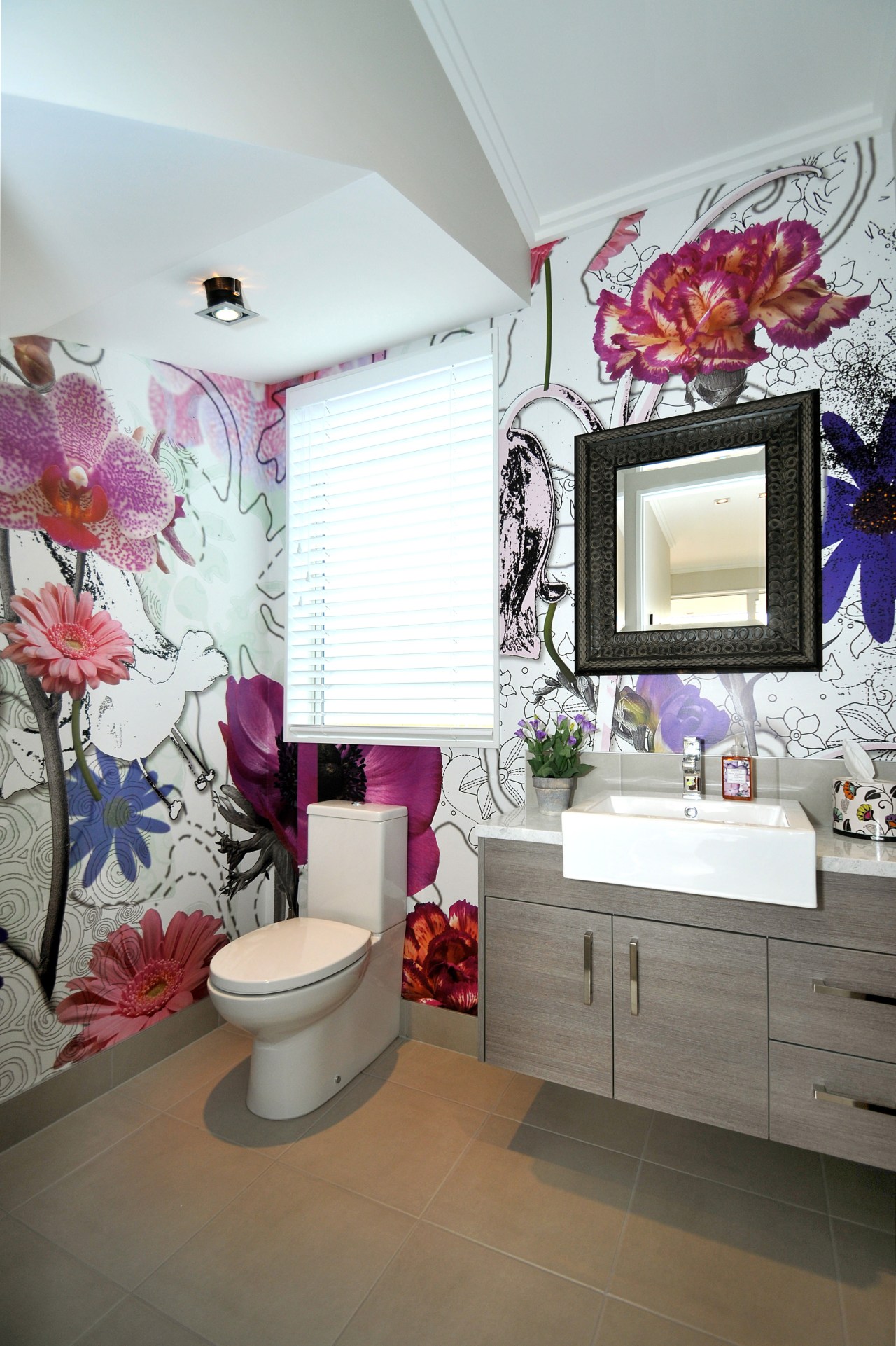 view of powder room at this Jalcon Homes bathroom, ceiling, floor, home, interior design, pink, purple, room, wall, gray, white