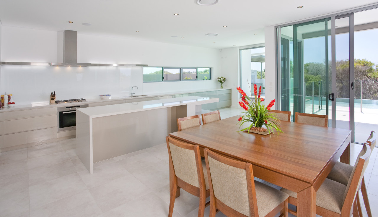 View of a kitchen and dining area which architecture, countertop, floor, house, interior design, kitchen, property, real estate, room, gray