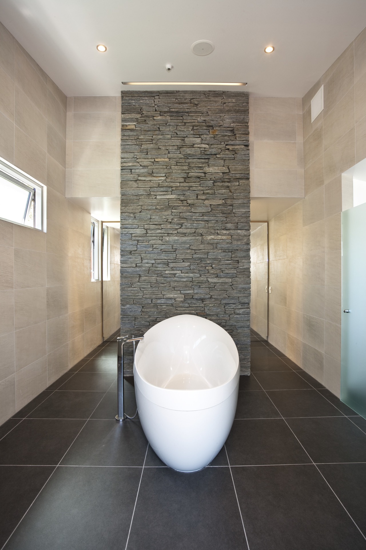 Interior view of this contemporary bathroom architecture, bathroom, ceiling, ceramic, daylighting, floor, flooring, interior design, plumbing fixture, room, sink, tile, wall, gray