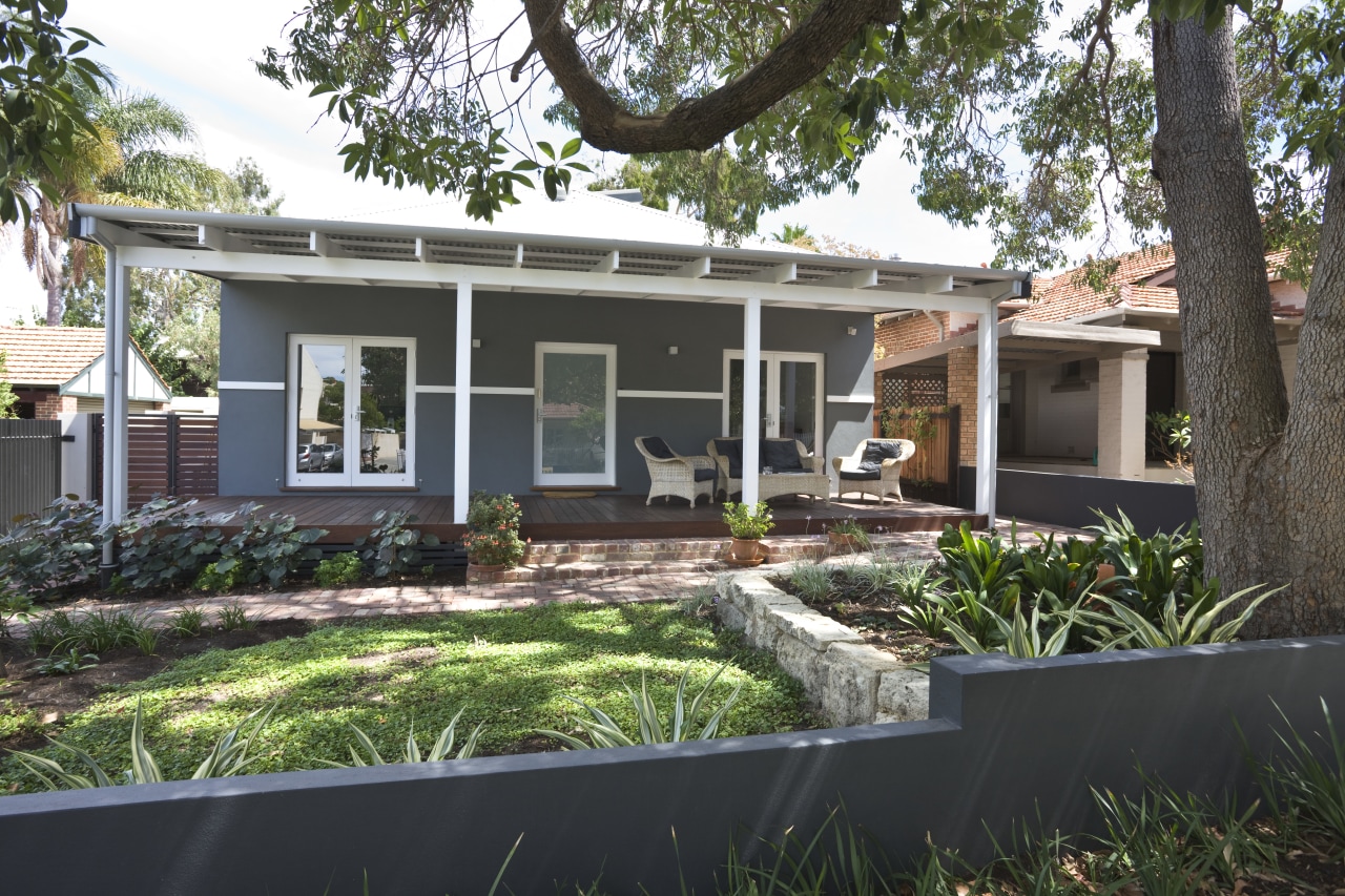 Exterior view of this entrance way backyard, cottage, estate, facade, home, house, property, real estate, residential area, window, yard, black