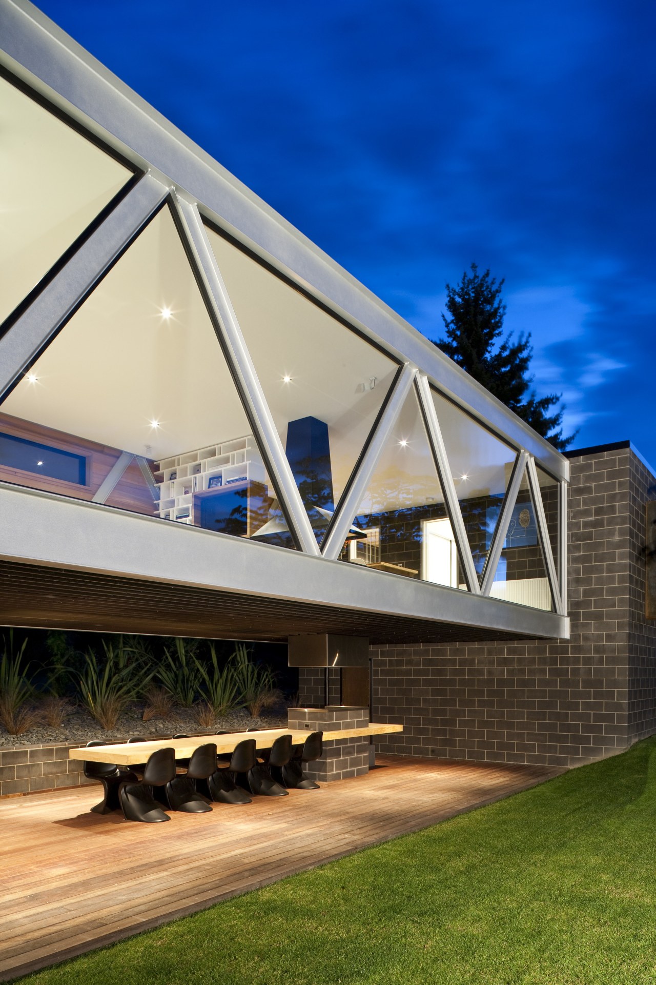 Exterior view of the glazed steel bridge. architecture, building, daylighting, facade, home, house, real estate, residential area, roof, sky, window, brown, blue