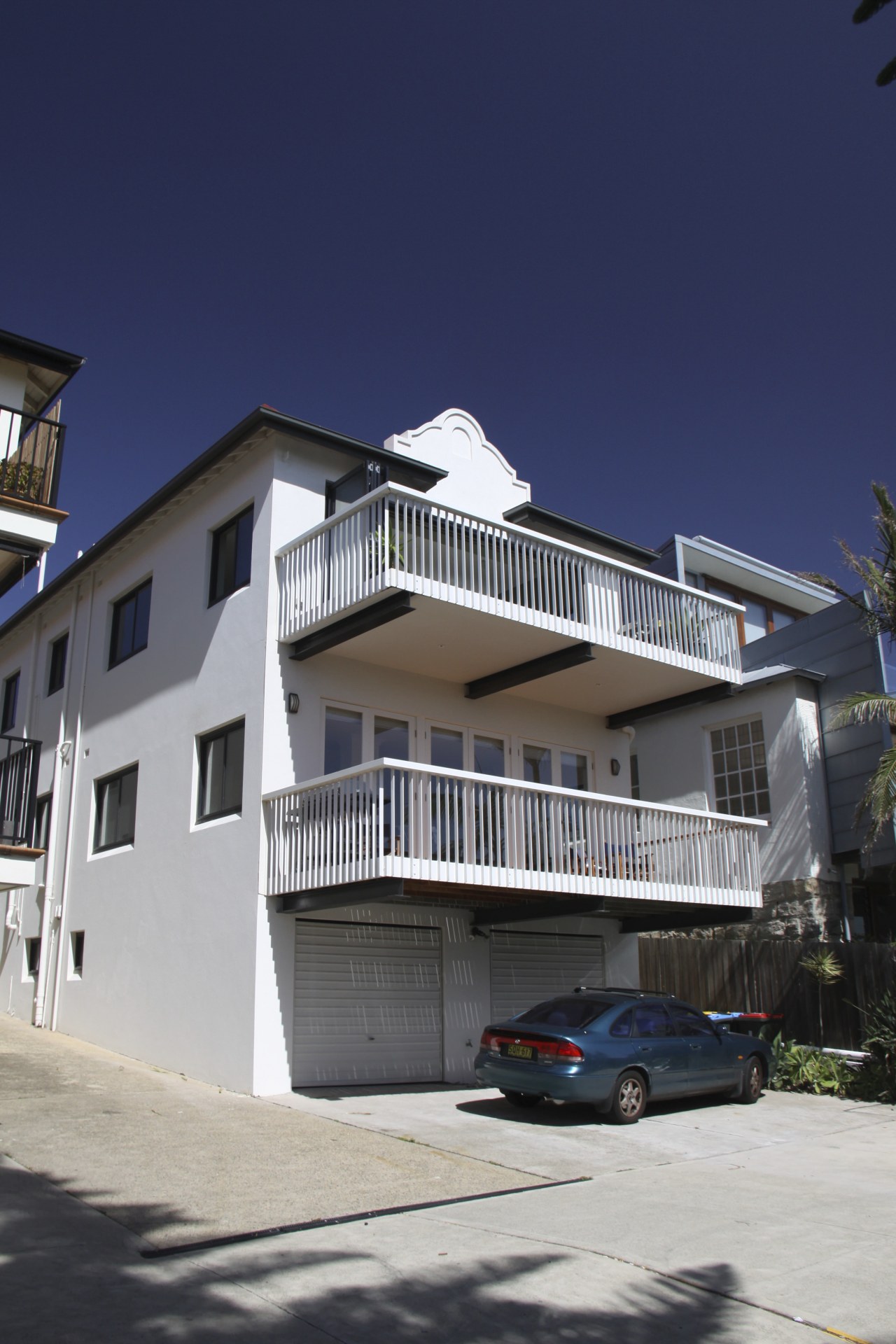 Exterior of this apartment apartment, architecture, building, condominium, elevation, estate, facade, home, house, neighbourhood, property, real estate, residential area, sky, villa, window, blue, gray
