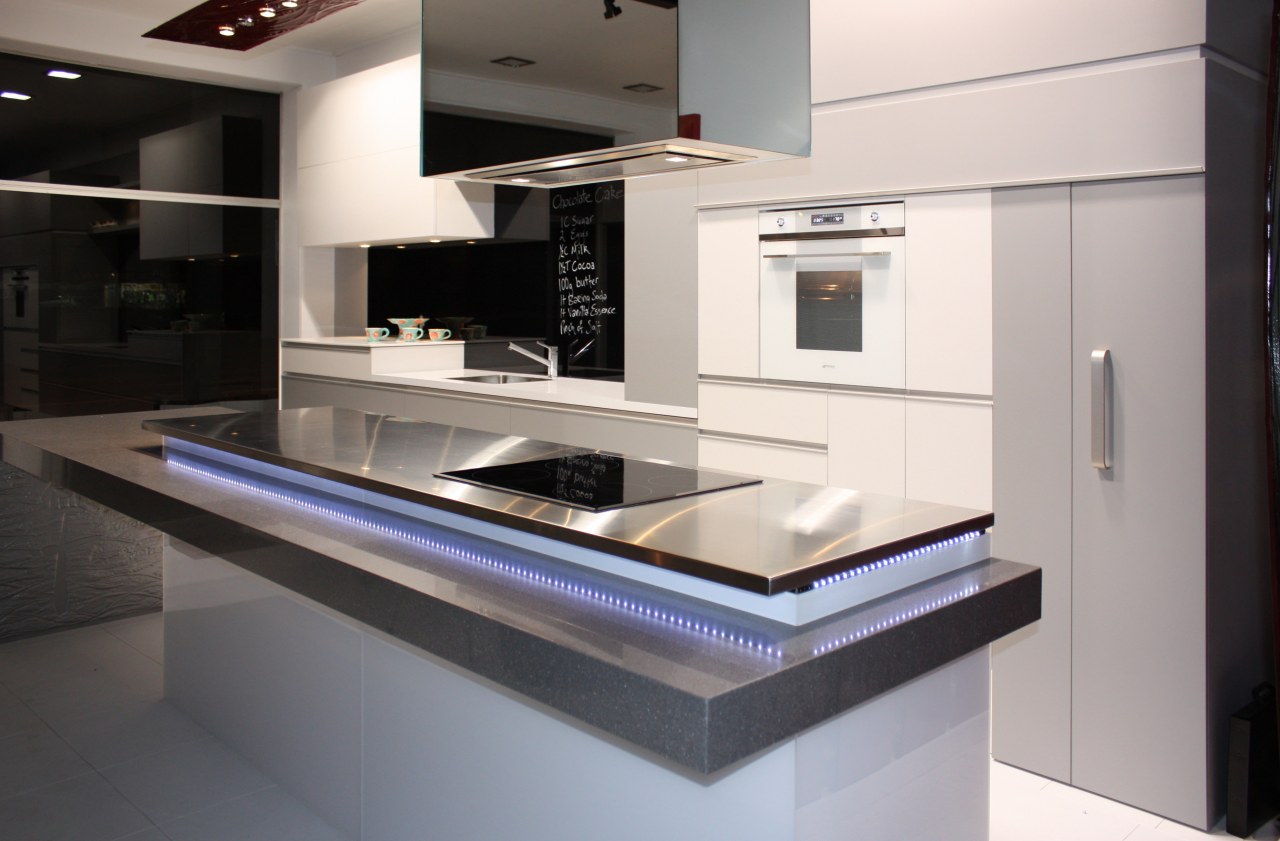 Interior view of this contemporary kitchen featuring LED countertop, home appliance, interior design, kitchen, product design, gray, black