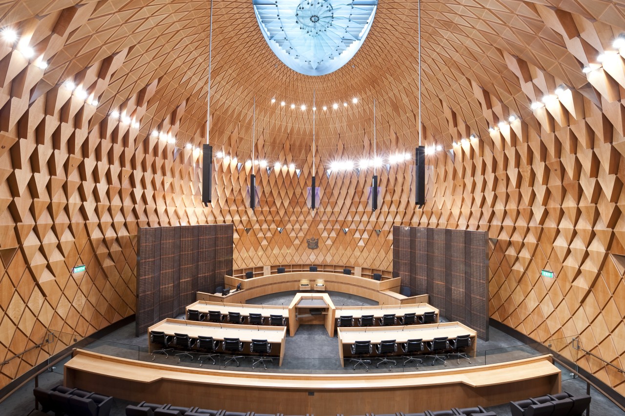 Interior view of the Supreme Court which features architecture, auditorium, building, ceiling, concert hall, performing arts center, symmetry, theatre, orange