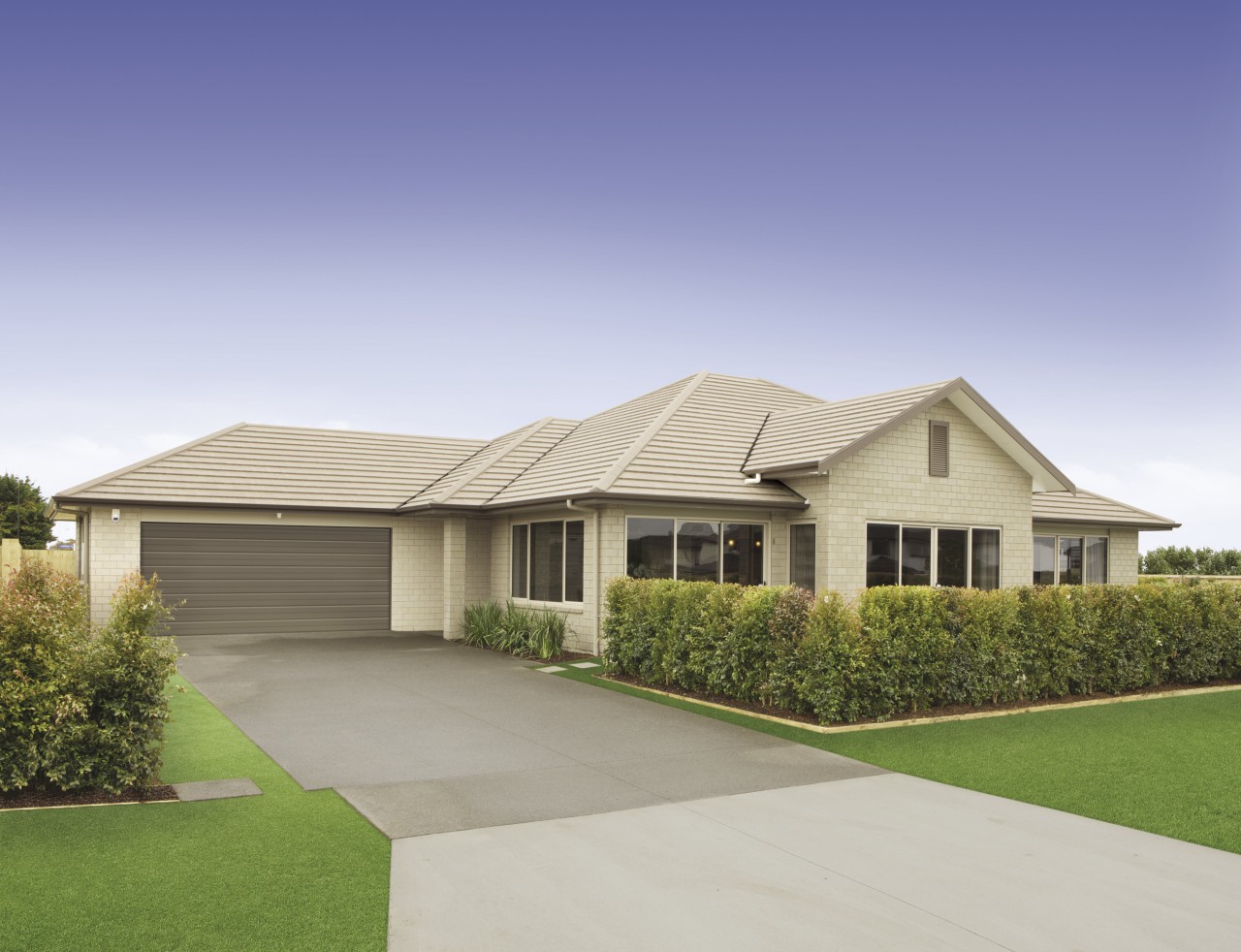 Exterior view of a Platinum Homes show home elevation, estate, facade, grass, home, house, land lot, landscape, property, real estate, residential area, roof, siding, suburb, gray