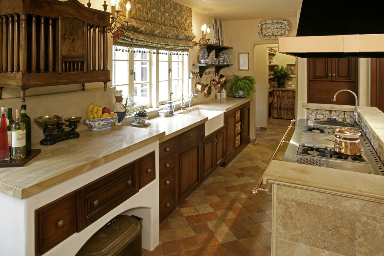 View of French-styled farmhouse kitchen which features terra cabinetry, countertop, cuisine classique, flooring, interior design, kitchen, room, brown