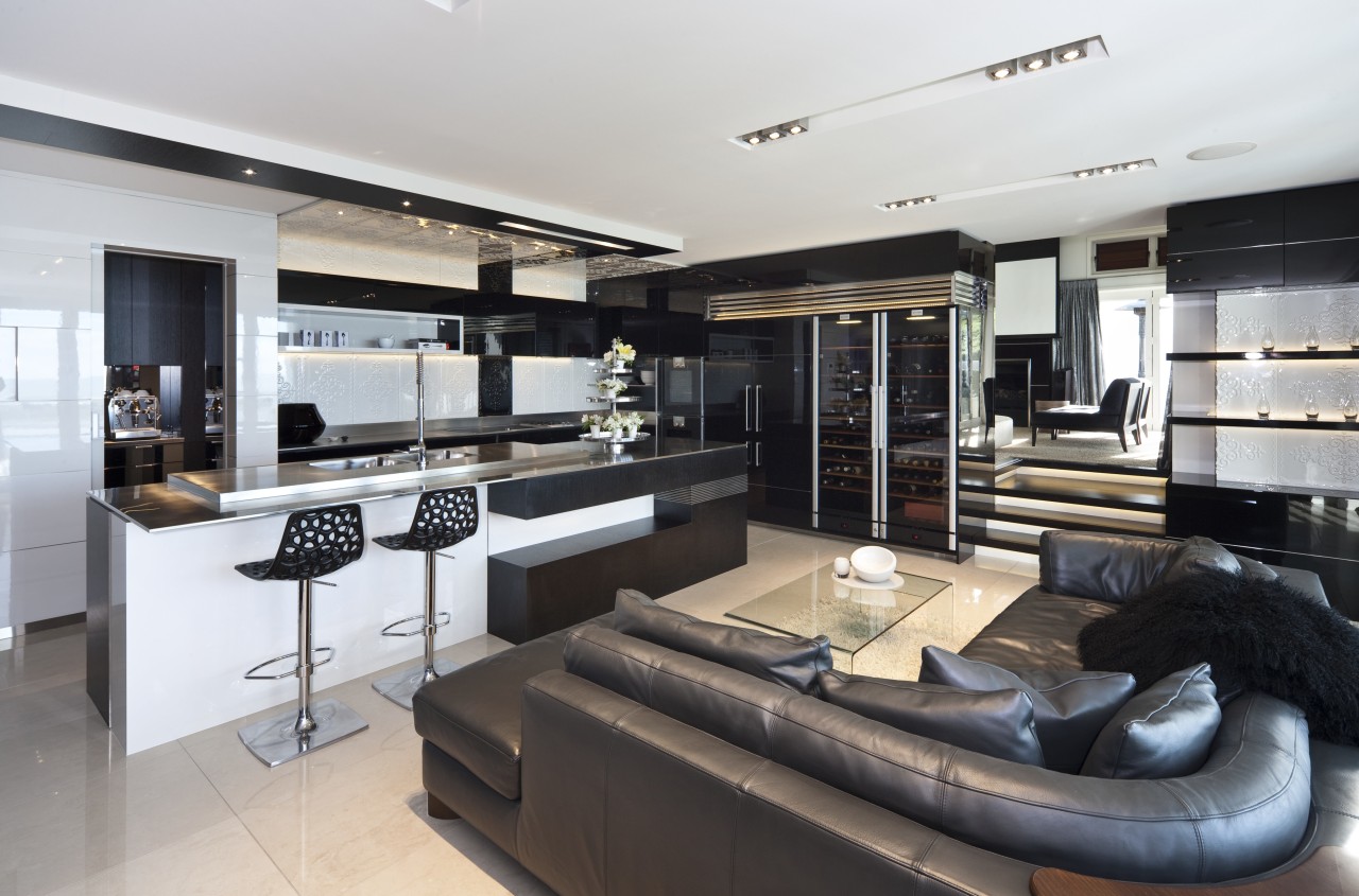 View of this living area situated by the interior design, kitchen, gray, black, white