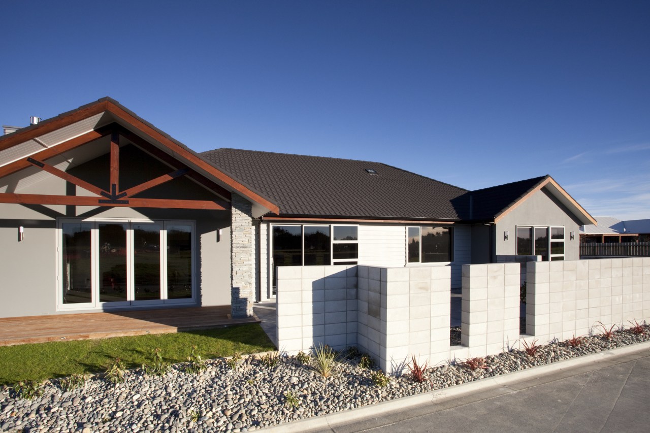 Exterior view of a David Reid Homes show building, cottage, elevation, estate, facade, home, house, property, real estate, residential area, roof, siding, blue