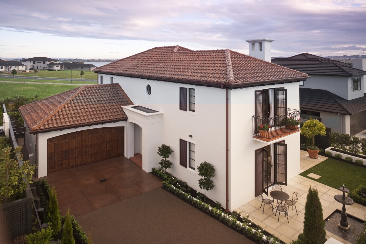 Exterior view of Eden Homes show home which building, elevation, estate, facade, home, house, mansion, outdoor structure, property, real estate, residential area, roof, suburb, villa