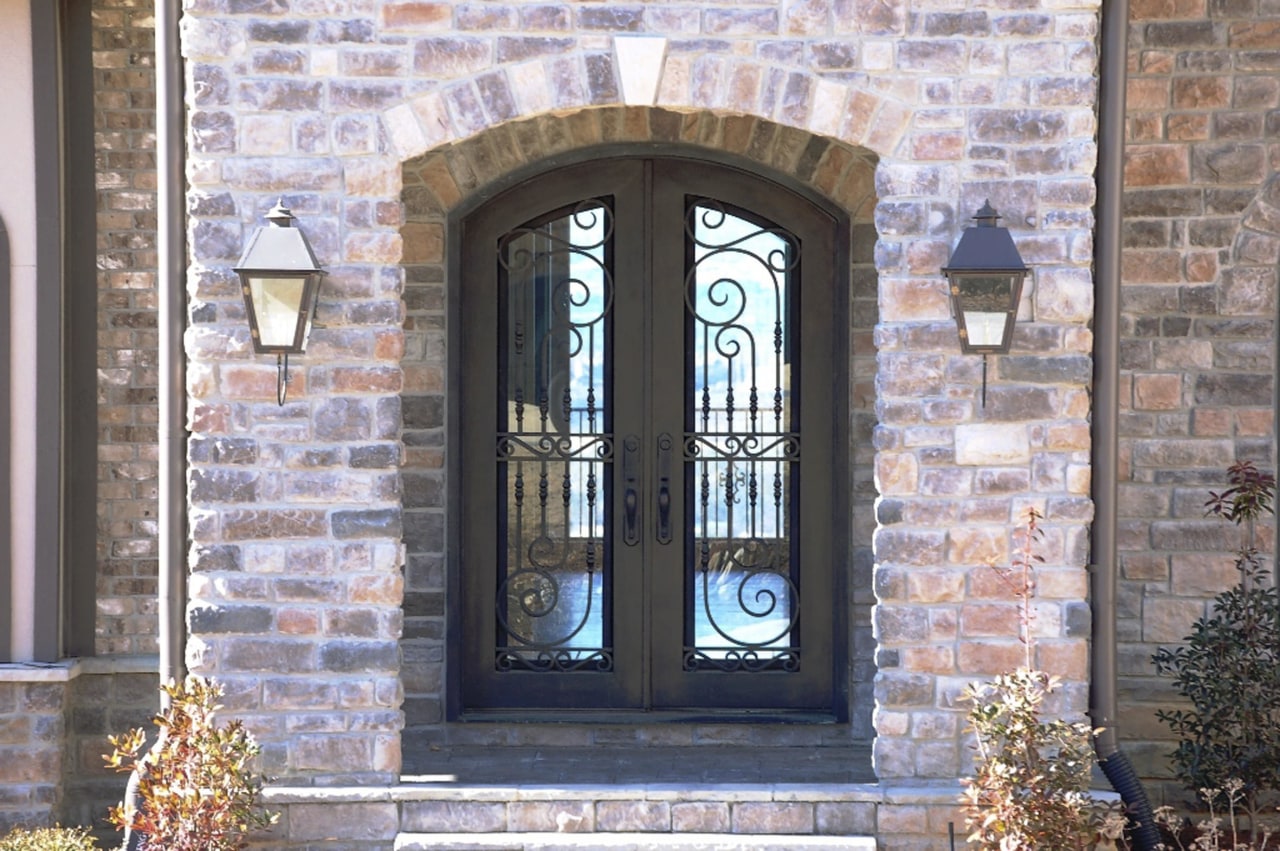 Grand entrance with brick wall &amp; iron door arch, brick, brickwork, door, facade, gate, iron, window, gray