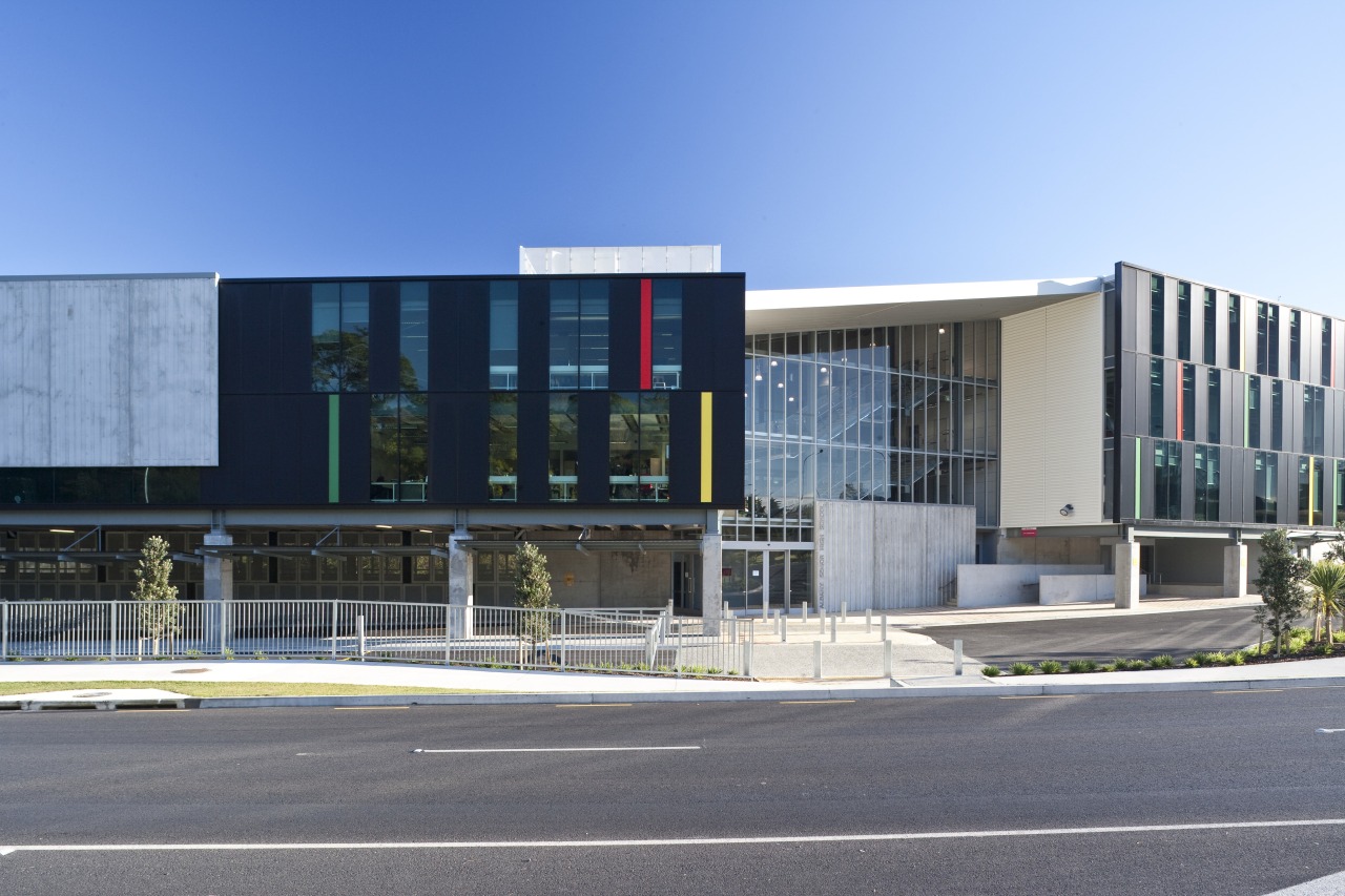 Exterior view of the educational centre architecture, building, commercial building, corporate headquarters, facade, headquarters, metropolitan area, mixed use, real estate, sky, teal, gray