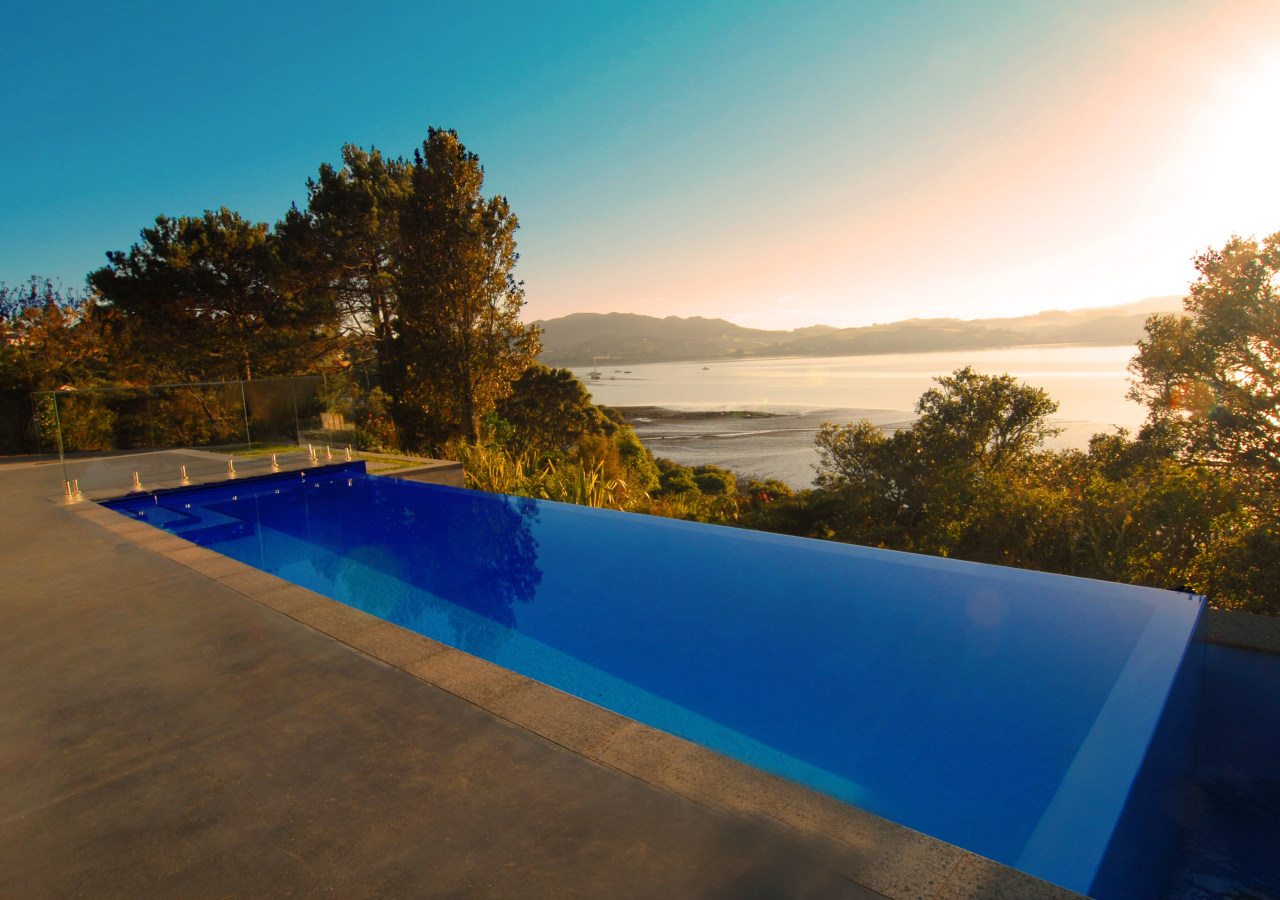 Exterior view of swimming pool by Mayfair Pools estate, evening, house, landscape, leisure, morning, property, real estate, reflection, sky, sunlight, swimming pool, water, brown