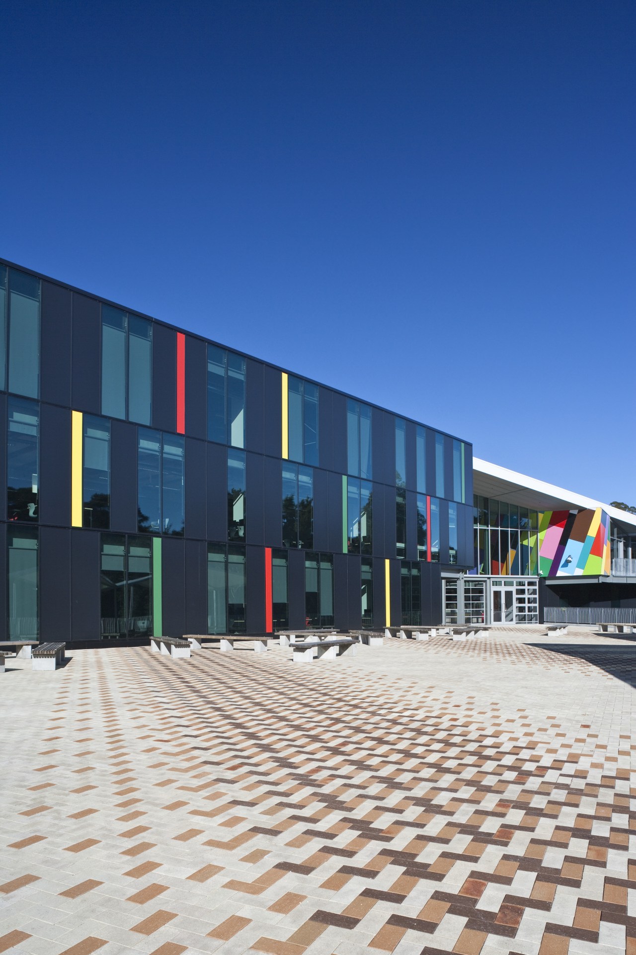 Exterior view of the Albany Senior High School architecture, building, commercial building, corporate headquarters, facade, mixed use, residential area, sky, structure, blue