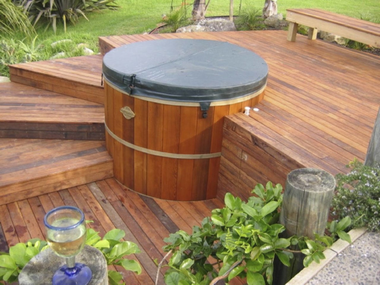 View of traditional style hot tub with deck backyard, wood, wood stain, yard, brown, orange