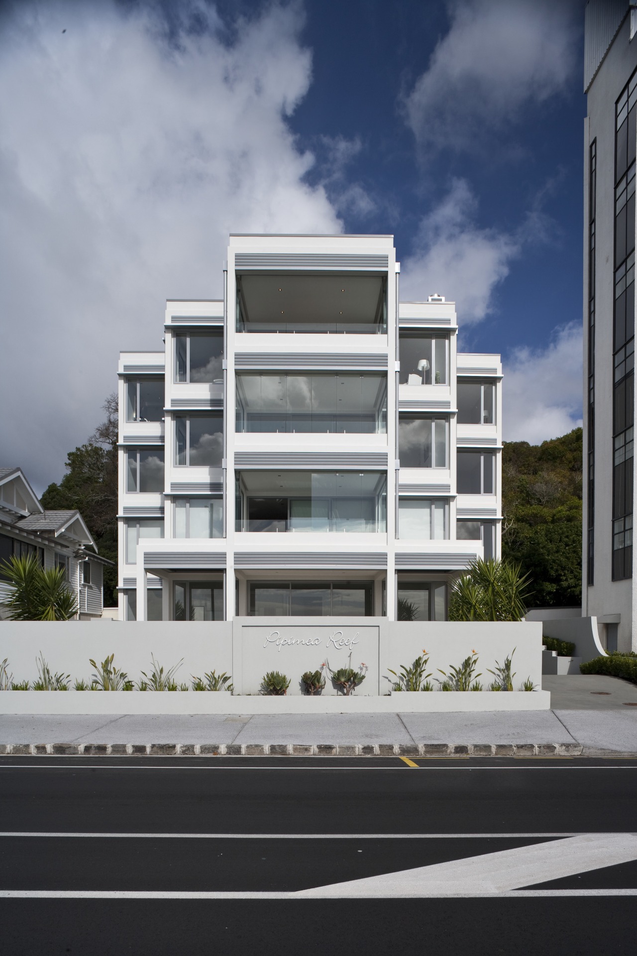 Exterior view of apartment building which features balconies apartment, architecture, building, commercial building, condominium, corporate headquarters, elevation, facade, home, house, mixed use, neighbourhood, property, real estate, residential area, sky, window, gray, black