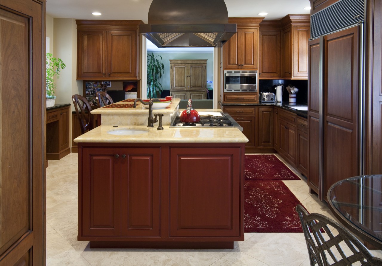 View of a traditional-styled kitchen designed by Pacific cabinetry, countertop, cuisine classique, hardwood, interior design, kitchen, room, red, brown