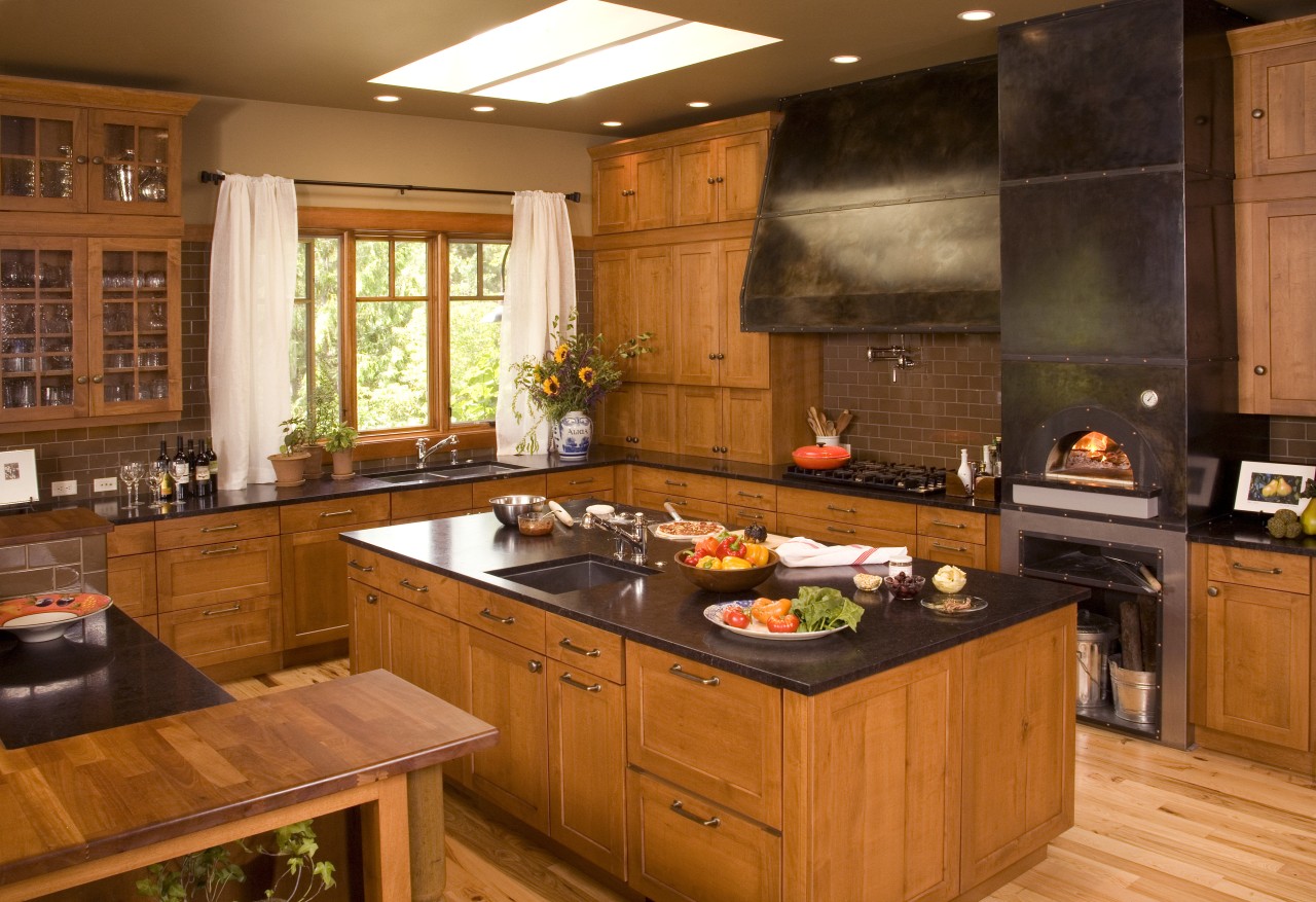 View of a Northwestern-styled kitchen with extensive wood cabinetry, countertop, cuisine classique, hardwood, interior design, kitchen, room, brown