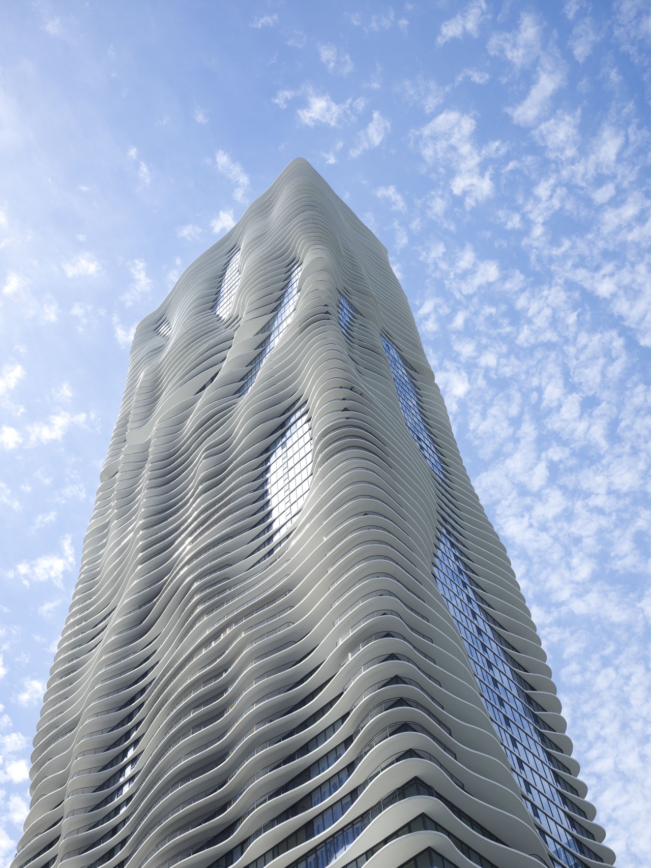 Exterior view of the Aqua Tower in Chicago architecture, building, cloud, daytime, landmark, sky, skyscraper, teal, gray