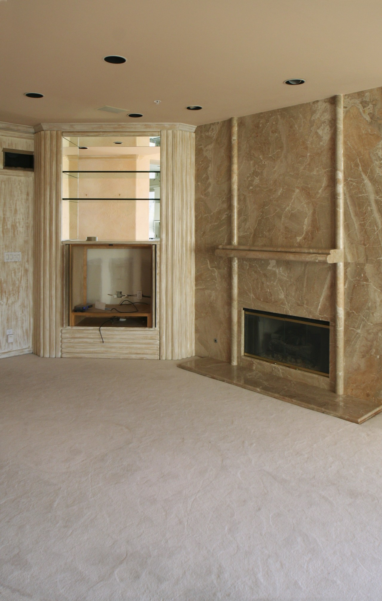 Interior view of this remodeled traditional condo by ceiling, fireplace, floor, flooring, hardwood, hearth, home, interior design, laminate flooring, living room, room, tile, wall, wood flooring, brown, gray