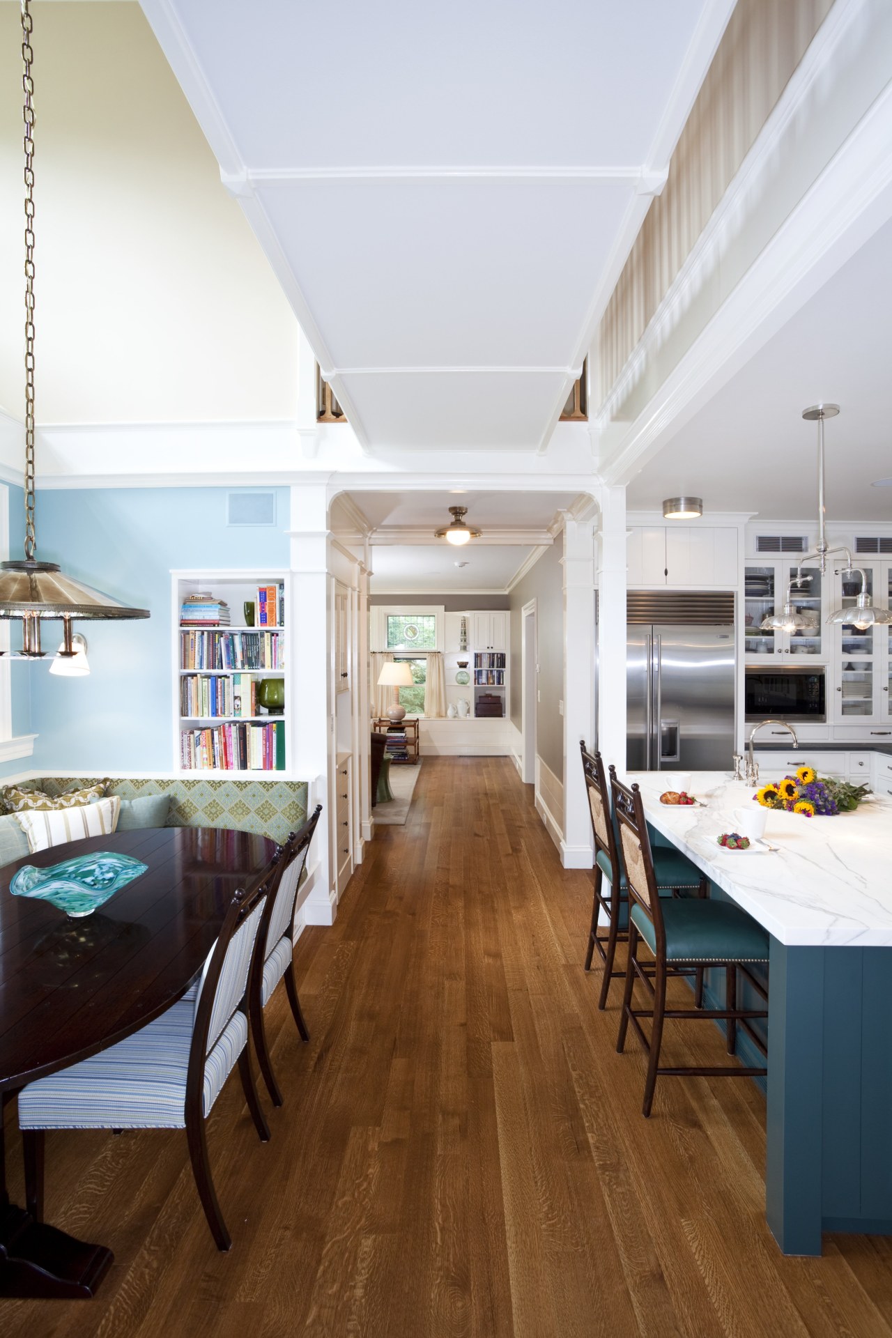 View of kitchen with dark turquoise island, colorful architecture, ceiling, daylighting, dining room, floor, flooring, hardwood, house, interior design, kitchen, living room, real estate, room, table, wood, wood flooring, white, brown