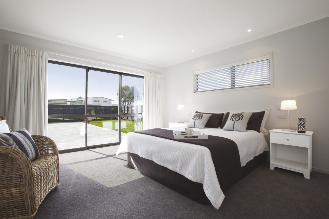 View of the master bedroom at Platinum Homes bed frame, bedroom, estate, floor, home, interior design, property, real estate, room, suite, window, gray