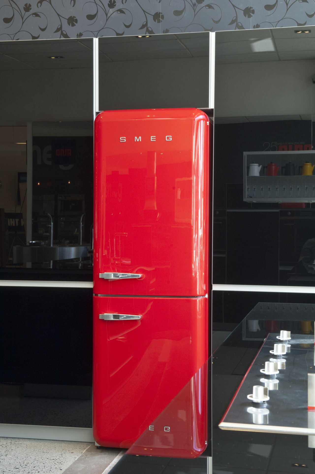 View of kitchen which features a Smeg 50s red, refrigerator, black, red