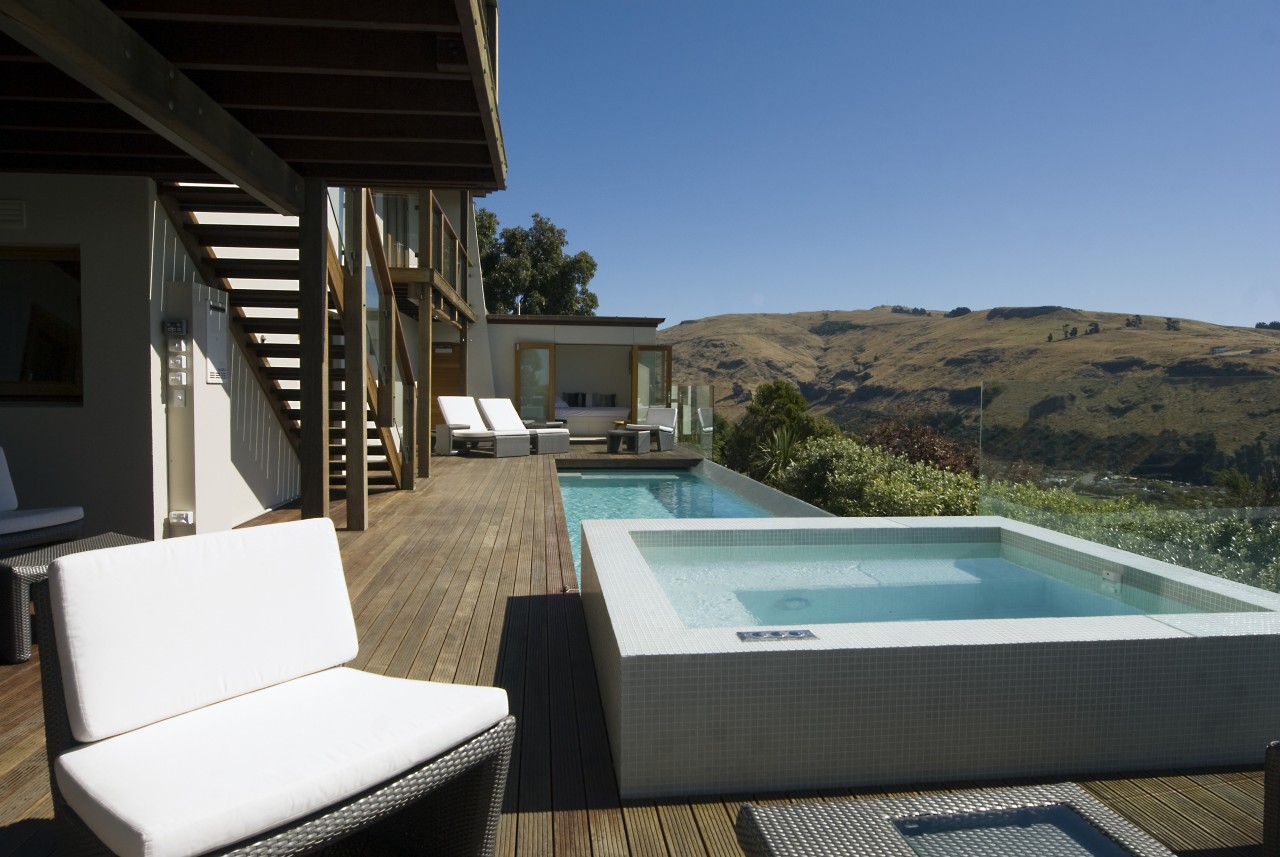 View of pool and spa area with wooden estate, home, house, property, real estate, resort, swimming pool, villa, black