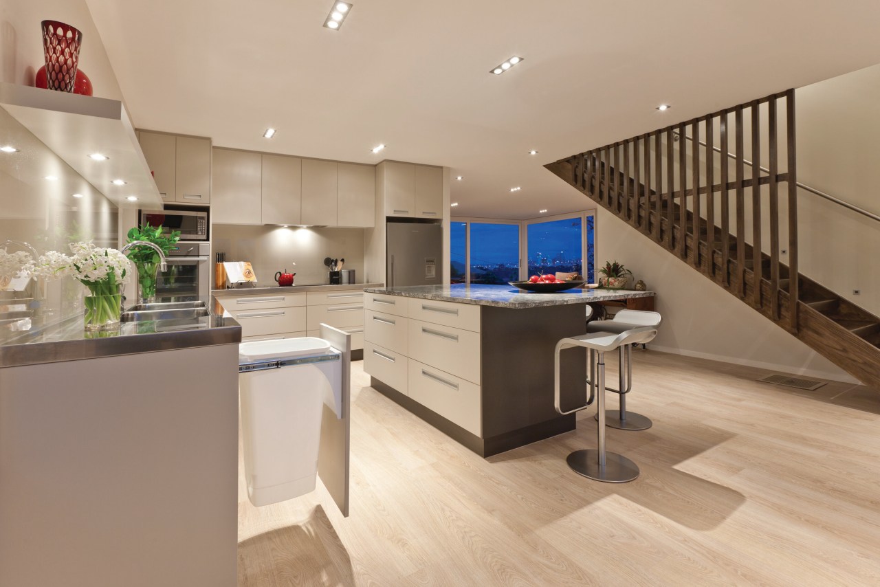 View of a large open-plan kitchen which features countertop, floor, interior design, kitchen, real estate, orange, brown