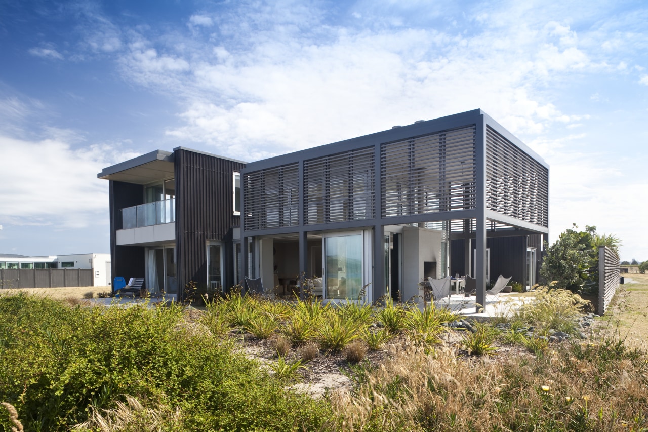 Contemporary beach house. Open-plan living architecture, building, corporate headquarters, facade, home, house, property, real estate, sky, white