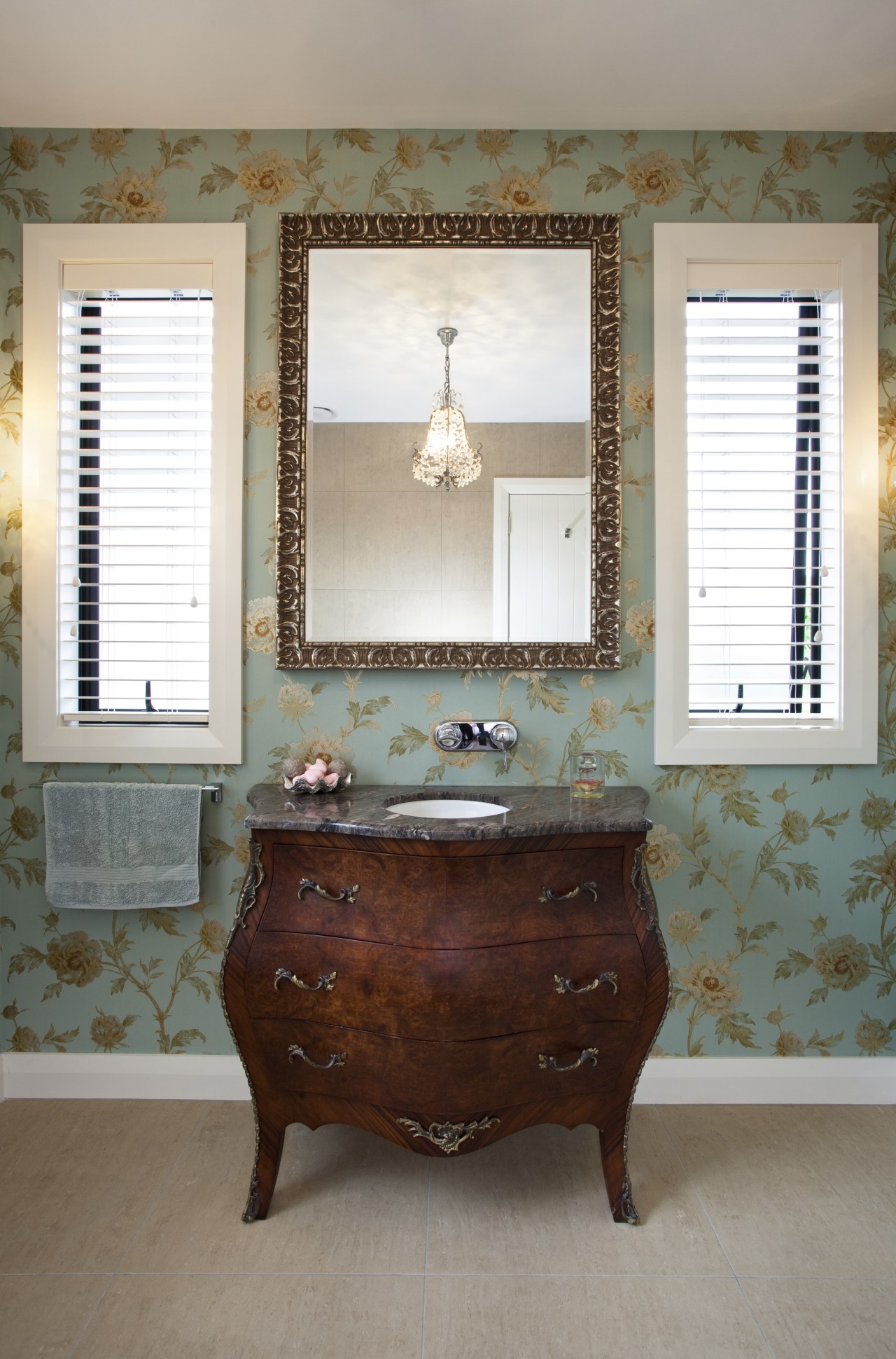 View of bathroom with floral wallpaper and dark-toned antique, bathroom accessory, chest of drawers, furniture, home, interior design, room, table, window, white, gray, brown