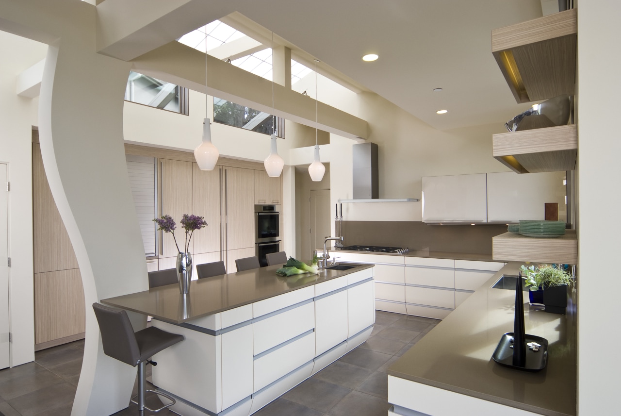 View of neutral-toned kitchen and dining space, featuring cabinetry, countertop, cuisine classique, interior design, kitchen, real estate, room, gray