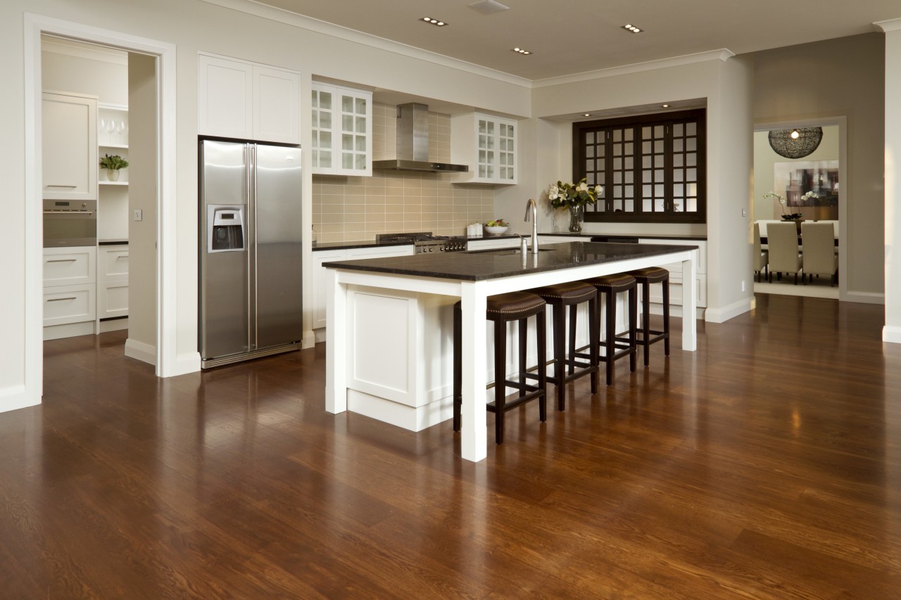 View of kitchen with wooden flooring, dark benchtops cabinetry, countertop, cuisine classique, floor, flooring, hardwood, interior design, kitchen, laminate flooring, room, wood, wood flooring, brown, gray