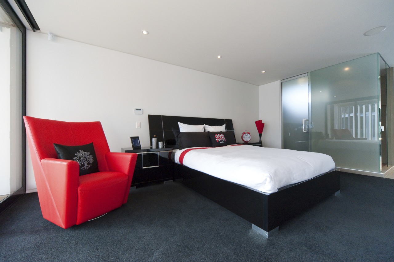 View of bedroom with dark floor , red architecture, bed frame, bedroom, floor, hotel, interior design, real estate, room, suite, white, gray, black