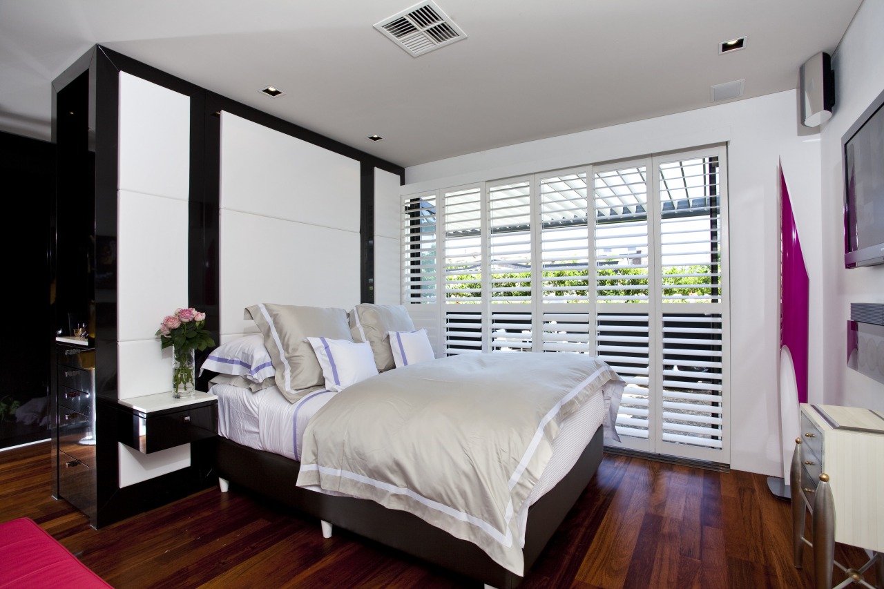 View of bedroom with neutral-toned bedding. bed frame, bedroom, ceiling, floor, home, interior design, property, real estate, room, window, window covering, gray