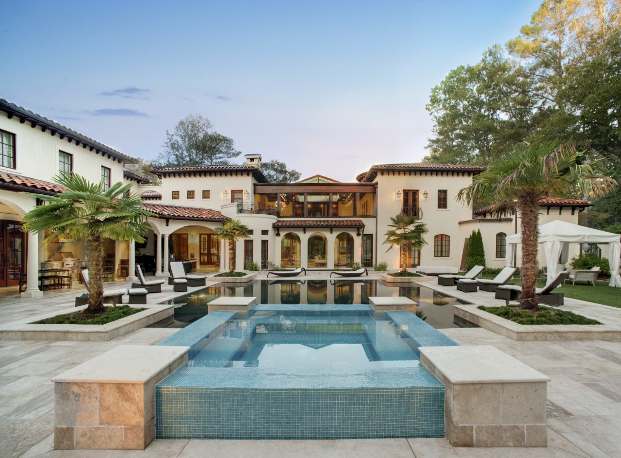 View of traditional home and pool area. courtyard, estate, hacienda, home, hotel, mansion, property, real estate, resort, swimming pool, villa, gray