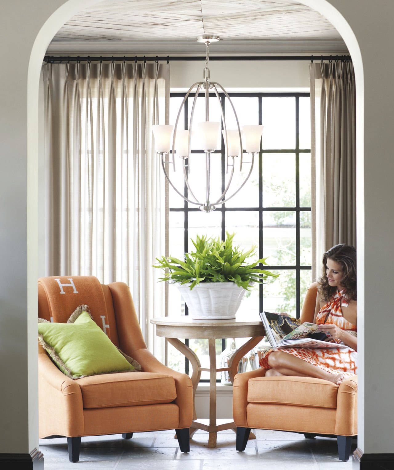 View of a sitting room with orange furniture curtain, furniture, home, interior design, living room, table, window, window blind, window covering, window treatment, white