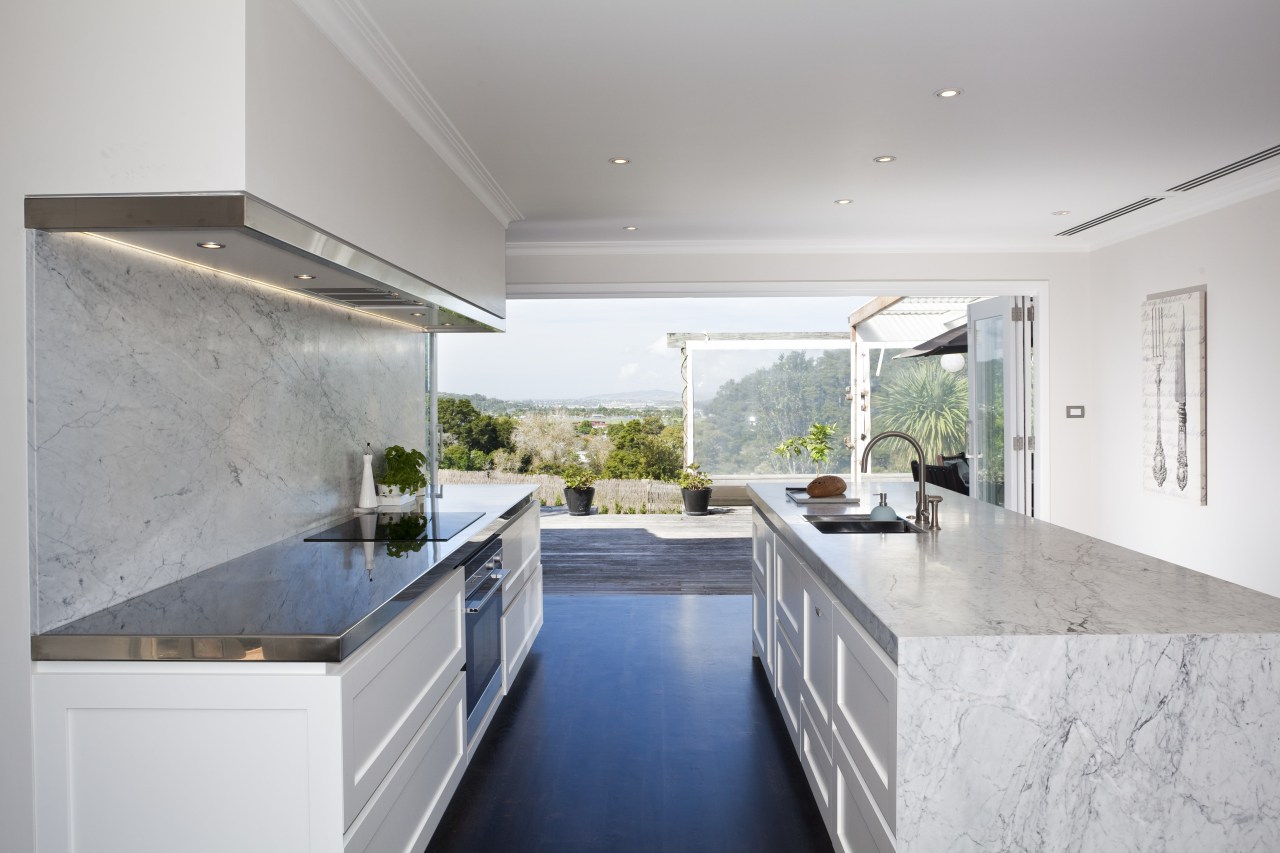 Carrara marble is used to create a centerpiece architecture, countertop, daylighting, estate, home, house, interior design, kitchen, property, real estate, gray