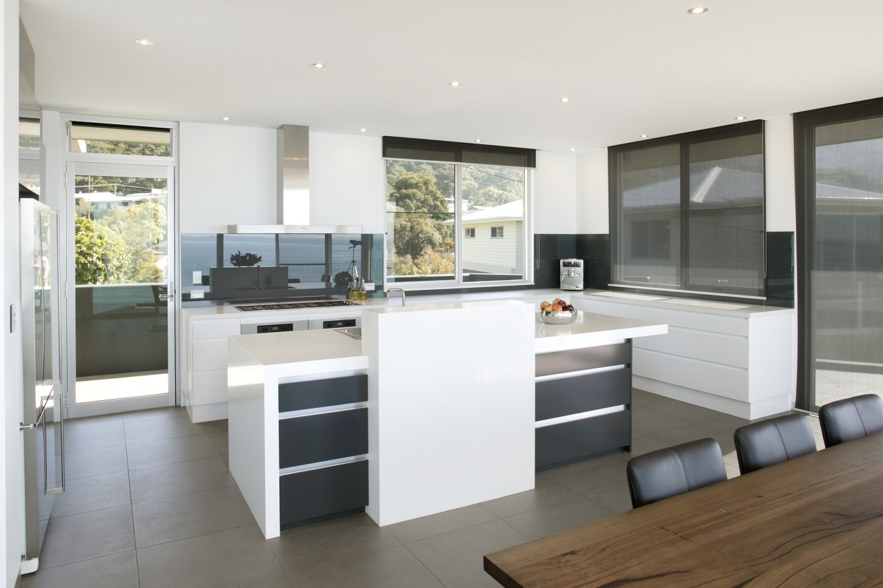 View of kitchen and dining area  designed cabinetry, countertop, cuisine classique, interior design, kitchen, real estate, white